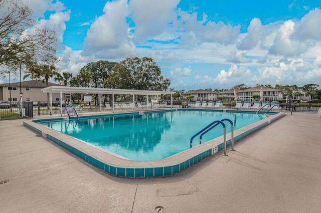 view of swimming pool featuring a patio area