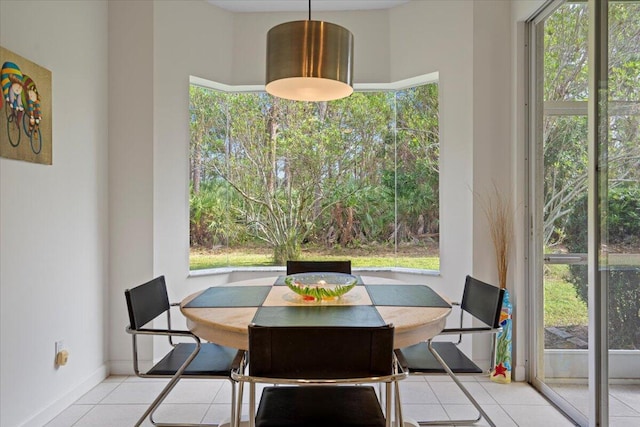 dining area featuring plenty of natural light and light tile patterned floors