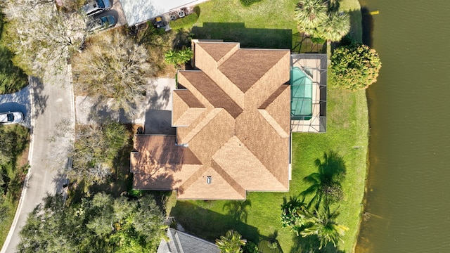 birds eye view of property with a water view