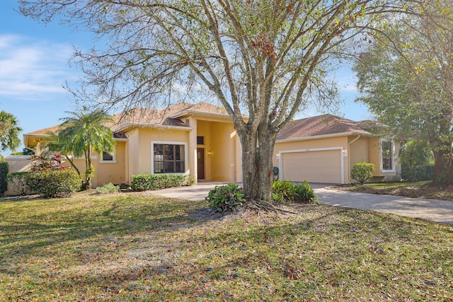 view of front of home with a garage and a front yard