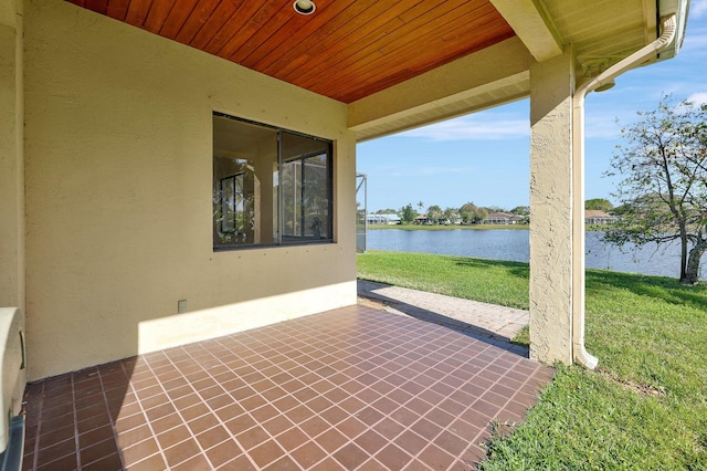 view of patio with a water view