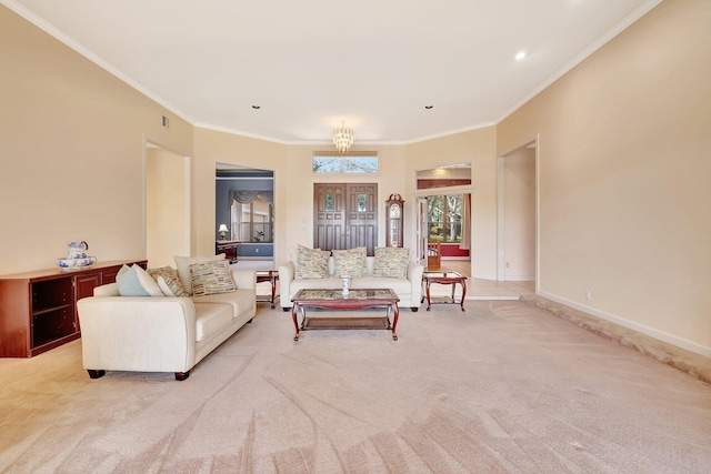 living room with an inviting chandelier, light colored carpet, and ornamental molding