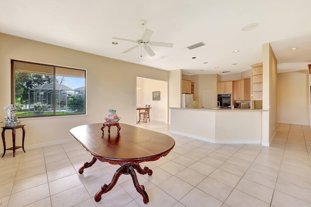 interior space with ceiling fan