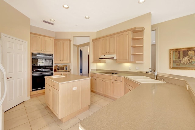 kitchen featuring sink, black appliances, and light brown cabinets