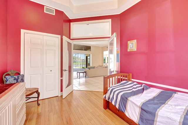 bedroom with a closet and light wood-type flooring