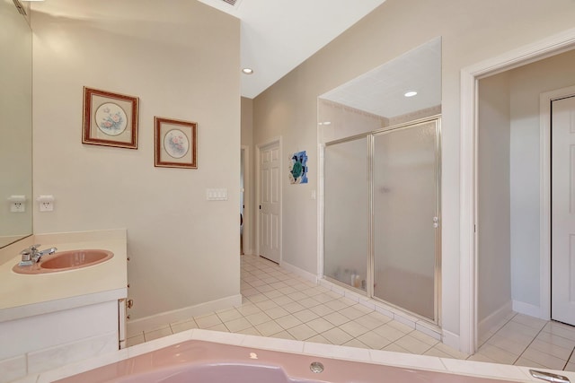 bathroom with tile patterned floors, shower with separate bathtub, and vanity