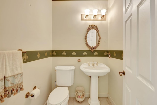 bathroom with tile patterned flooring and toilet