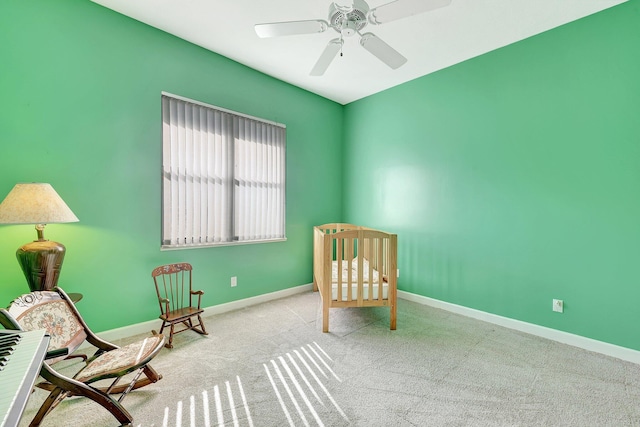 unfurnished room featuring ceiling fan and light carpet