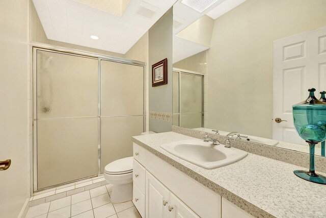 bathroom with vanity, toilet, an enclosed shower, and tile patterned flooring