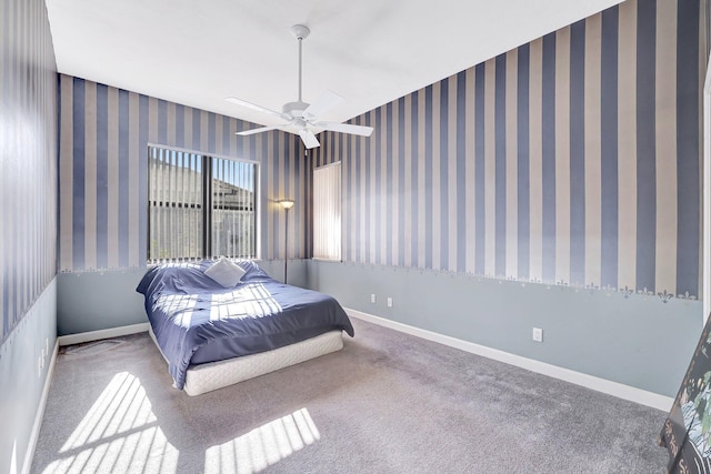 bedroom featuring ceiling fan and carpet