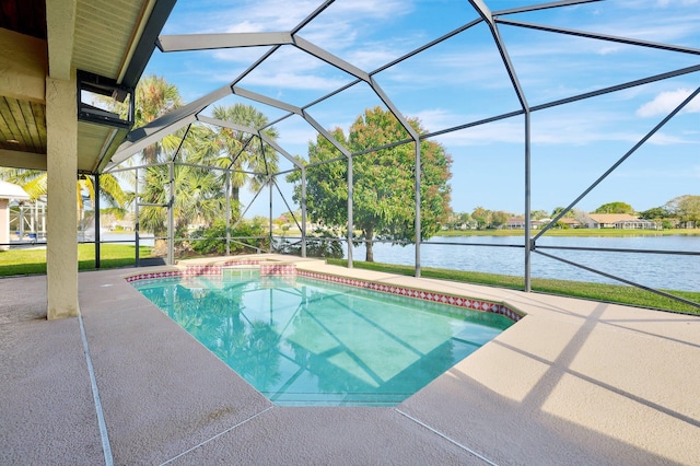 view of pool featuring a patio, a water view, and glass enclosure