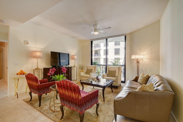 living room featuring floor to ceiling windows, ceiling fan, and light tile patterned flooring