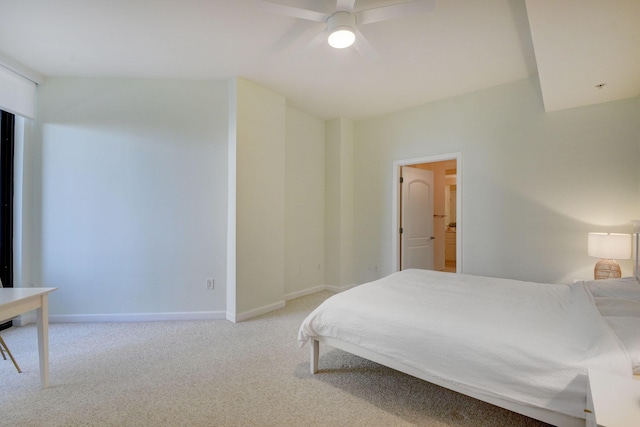 bedroom featuring light carpet, ceiling fan, and ensuite bathroom