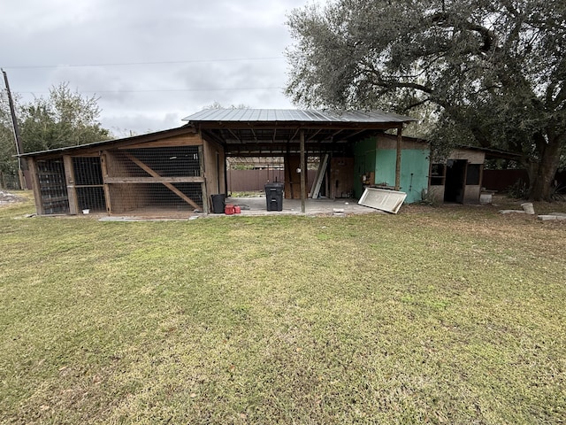 view of outbuilding with a lawn