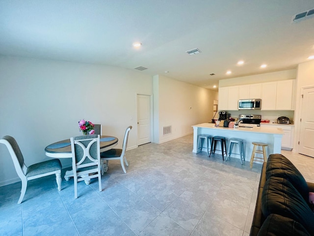 dining space featuring sink