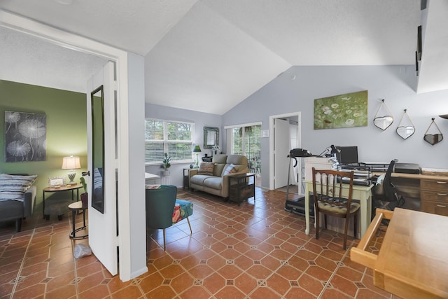 tiled living room featuring vaulted ceiling and a textured ceiling