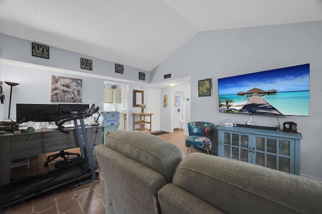 tiled living room with vaulted ceiling