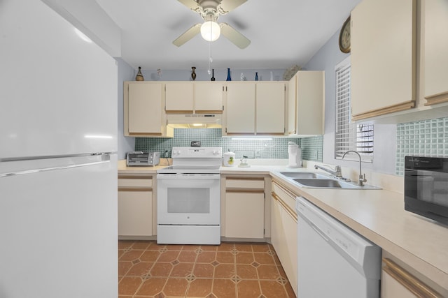 kitchen featuring sink, cream cabinetry, decorative backsplash, and white appliances