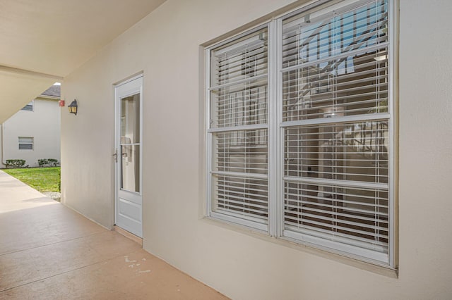 property entrance featuring a patio area