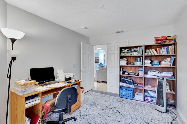 home office with a textured ceiling