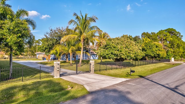 12855 87th St N, West Palm Beach, FL 33412 - view of property's community featuring concrete driveway and a gate