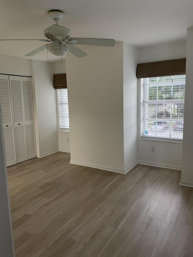 unfurnished room featuring ceiling fan and hardwood / wood-style floors