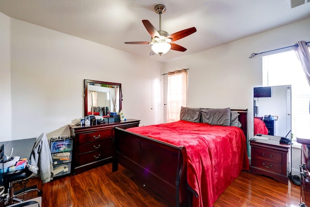 bedroom featuring ceiling fan and dark hardwood / wood-style floors