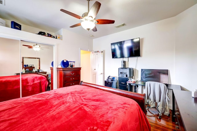 bedroom with hardwood / wood-style flooring and ceiling fan