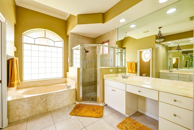 bathroom featuring plus walk in shower, tile patterned floors, and vanity