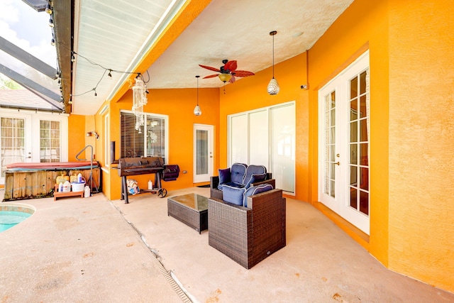 view of patio featuring an outdoor hangout area, a hot tub, french doors, and ceiling fan