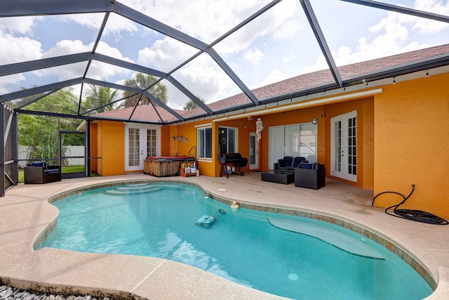 view of pool featuring a patio area, a hot tub, and french doors