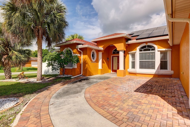 entrance to property with solar panels