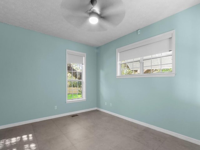 unfurnished room featuring ceiling fan