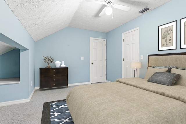 carpeted bedroom featuring a textured ceiling, ceiling fan, and lofted ceiling