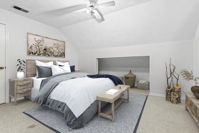 bedroom with ceiling fan, light carpet, and vaulted ceiling