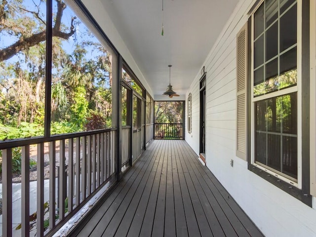 wooden deck with ceiling fan