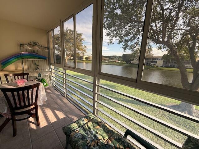 sunroom with a water view