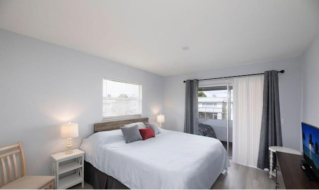 bedroom with wood-type flooring