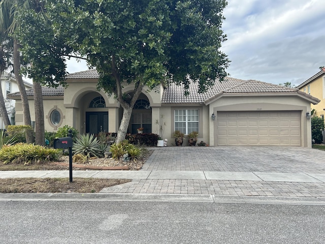 view of front of property with a garage