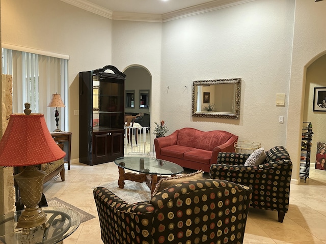 living room featuring light tile patterned floors and ornamental molding