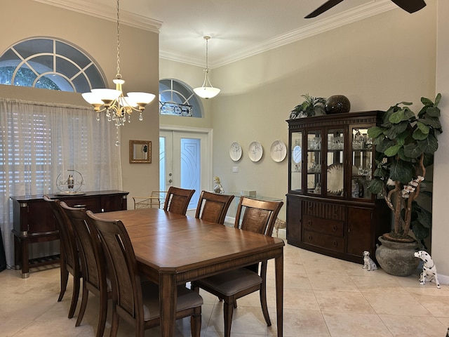 dining room featuring light tile patterned floors, crown molding, ceiling fan with notable chandelier, and french doors