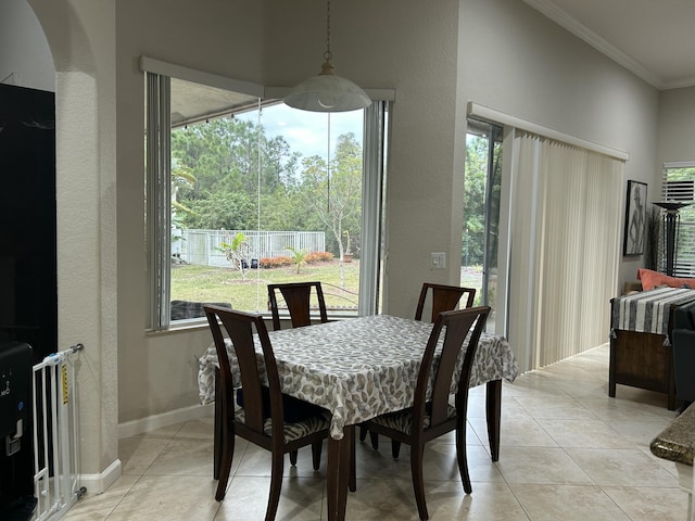 tiled dining area with crown molding