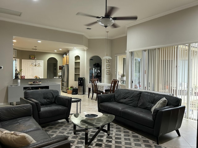 living room featuring ceiling fan, light tile patterned floors, and ornamental molding