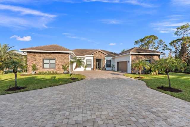 single story home with a garage and a front yard