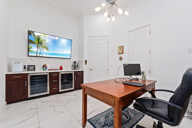 office space with wine cooler, bar, crown molding, and an inviting chandelier