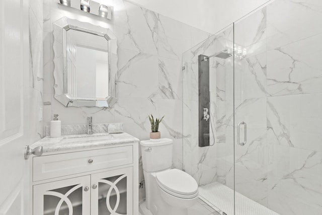 bathroom featuring vanity, toilet, and an enclosed shower