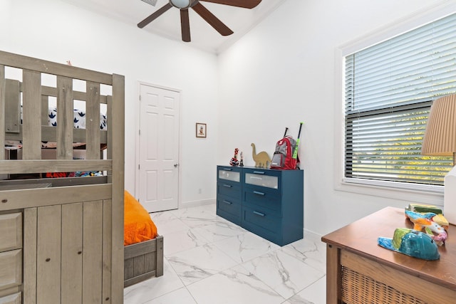 bedroom featuring ornamental molding and ceiling fan