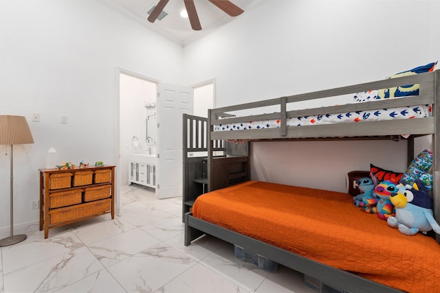 bedroom featuring ornamental molding and connected bathroom