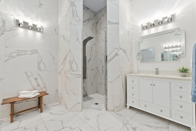 bathroom featuring vanity and a shower with door