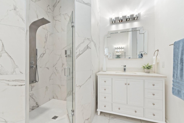 bathroom with vanity and a shower with door